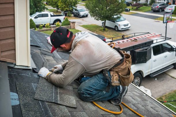 Professional Emergency Roof Repair technician working in Foster, KY